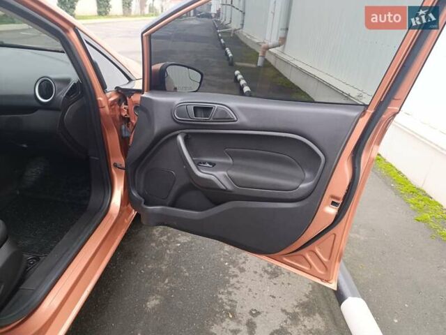 Оранжевый Форд Фиеста, объемом двигателя 1.6 л и пробегом 144 тыс. км за 7999 $, фото 22 на Automoto.ua