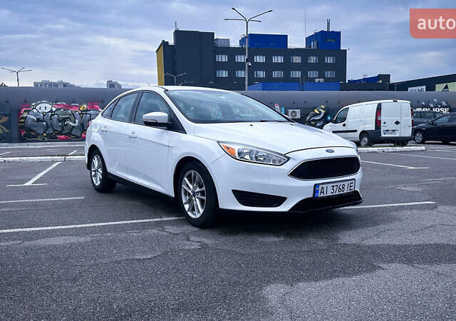 Білий Форд Фокус, об'ємом двигуна 2 л та пробігом 105 тис. км за 9800 $, фото 1 на Automoto.ua