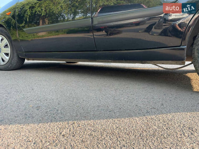 Черный Форд Фокус, объемом двигателя 1.6 л и пробегом 268 тыс. км за 3800 $, фото 5 на Automoto.ua