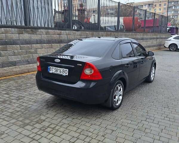 Черный Форд Фокус, объемом двигателя 1.8 л и пробегом 220 тыс. км за 5999 $, фото 8 на Automoto.ua