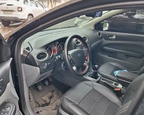 Черный Форд Фокус, объемом двигателя 1.8 л и пробегом 220 тыс. км за 5999 $, фото 13 на Automoto.ua