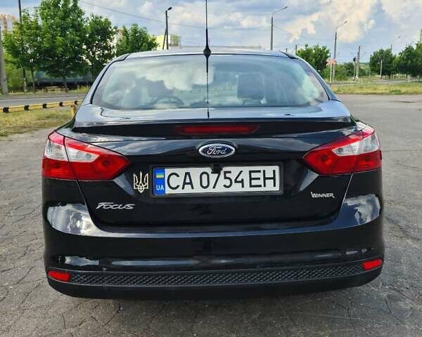 Черный Форд Фокус, объемом двигателя 1.6 л и пробегом 129 тыс. км за 6850 $, фото 4 на Automoto.ua