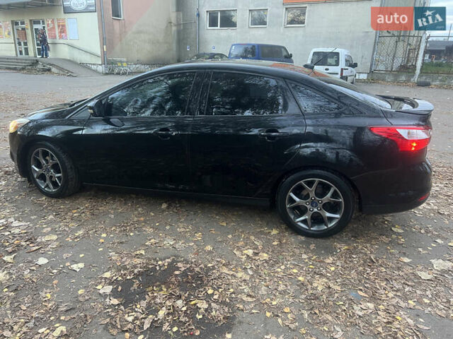 Чорний Форд Фокус, об'ємом двигуна 2 л та пробігом 163 тис. км за 7700 $, фото 4 на Automoto.ua