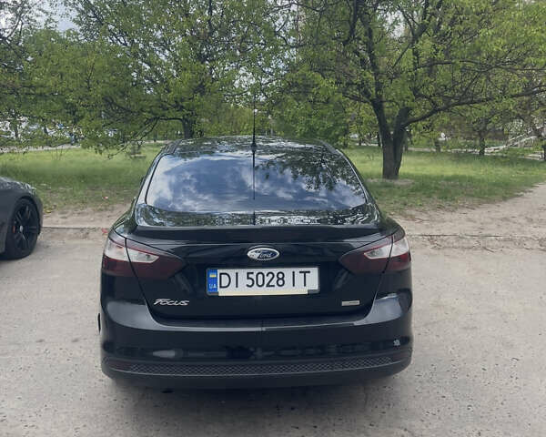 Черный Форд Фокус, объемом двигателя 1 л и пробегом 198 тыс. км за 5800 $, фото 1 на Automoto.ua