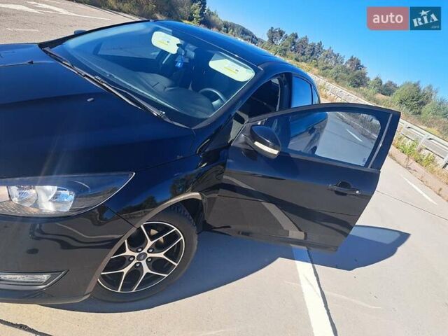 Чорний Форд Фокус, об'ємом двигуна 2 л та пробігом 95 тис. км за 9480 $, фото 18 на Automoto.ua