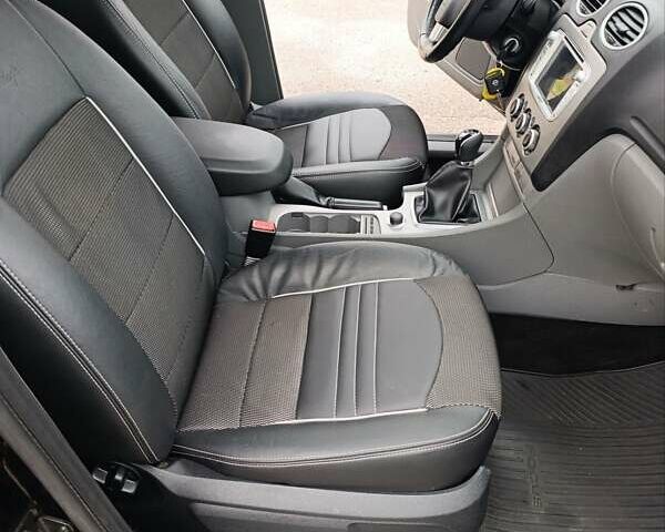 Черный Форд Фокус, объемом двигателя 1.8 л и пробегом 170 тыс. км за 6400 $, фото 27 на Automoto.ua