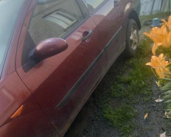 Красный Форд Фокус, объемом двигателя 1.6 л и пробегом 266 тыс. км за 1700 $, фото 4 на Automoto.ua