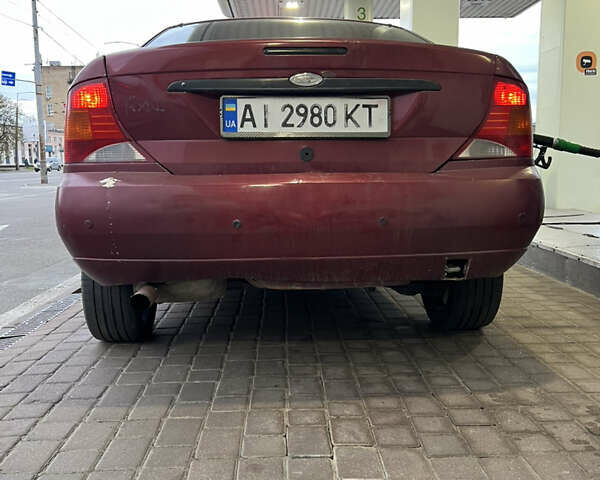 Красный Форд Фокус, объемом двигателя 1.8 л и пробегом 250 тыс. км за 2999 $, фото 7 на Automoto.ua