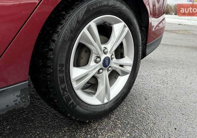 Червоний Форд Фокус, об'ємом двигуна 2 л та пробігом 139 тис. км за 8159 $, фото 13 на Automoto.ua