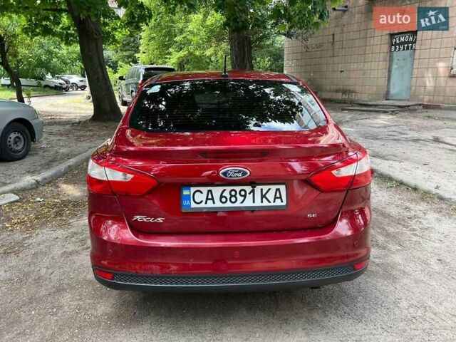 Красный Форд Фокус, объемом двигателя 2 л и пробегом 127 тыс. км за 7700 $, фото 1 на Automoto.ua