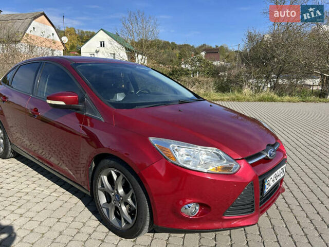 Червоний Форд Фокус, об'ємом двигуна 2 л та пробігом 165 тис. км за 7100 $, фото 4 на Automoto.ua