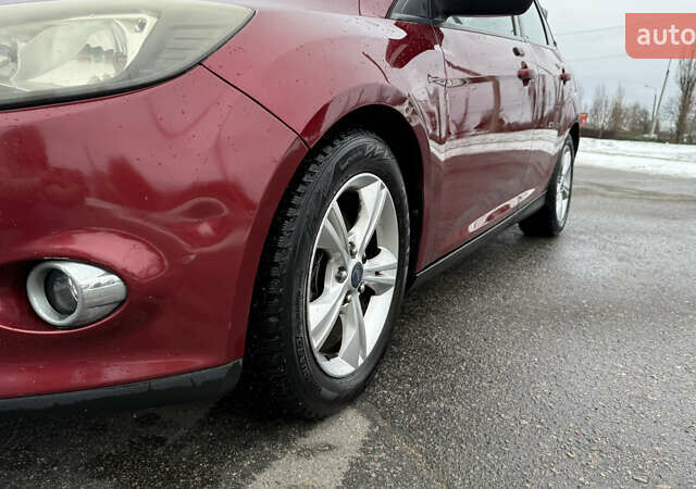 Червоний Форд Фокус, об'ємом двигуна 2 л та пробігом 139 тис. км за 8159 $, фото 3 на Automoto.ua
