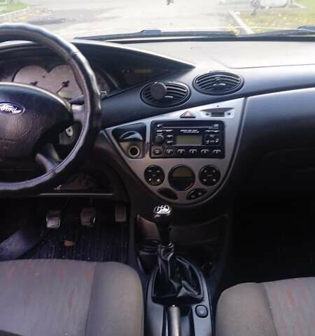 Красный Форд Фокус, объемом двигателя 1.8 л и пробегом 223 тыс. км за 3500 $, фото 5 на Automoto.ua