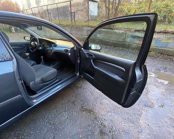 Серый Форд Фокус, объемом двигателя 1.8 л и пробегом 327 тыс. км за 3500 $, фото 10 на Automoto.ua