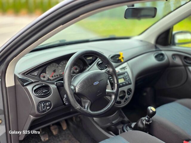 Серый Форд Фокус, объемом двигателя 1.8 л и пробегом 275 тыс. км за 1999 $, фото 19 на Automoto.ua