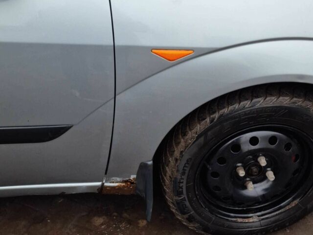 Серый Форд Фокус, объемом двигателя 1.8 л и пробегом 300 тыс. км за 961 $, фото 6 на Automoto.ua