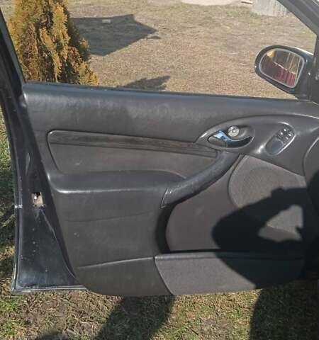 Серый Форд Фокус, объемом двигателя 1.8 л и пробегом 376 тыс. км за 2400 $, фото 19 на Automoto.ua