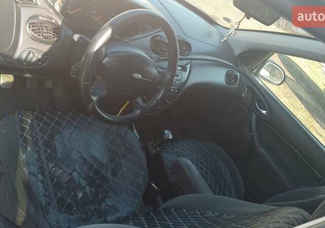 Серый Форд Фокус, объемом двигателя 1.8 л и пробегом 376 тыс. км за 2400 $, фото 18 на Automoto.ua