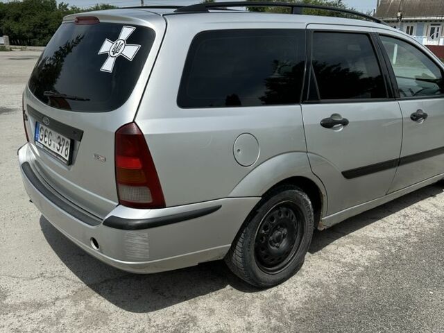 Серый Форд Фокус, объемом двигателя 1.8 л и пробегом 327 тыс. км за 1309 $, фото 2 на Automoto.ua