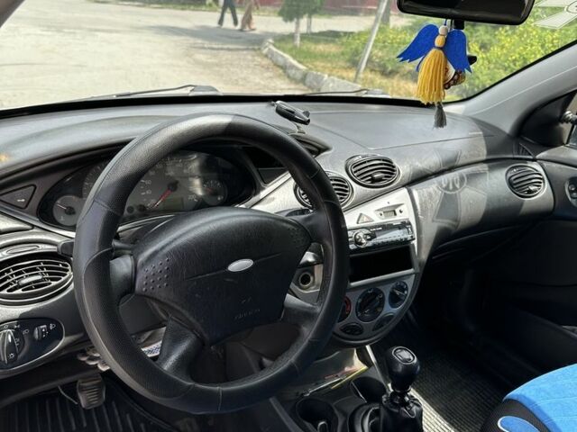 Серый Форд Фокус, объемом двигателя 1.8 л и пробегом 327 тыс. км за 1309 $, фото 7 на Automoto.ua