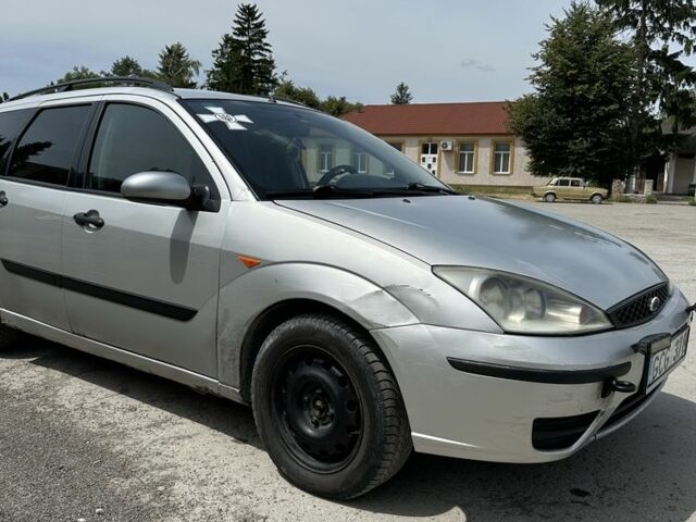 Серый Форд Фокус, объемом двигателя 1.8 л и пробегом 327 тыс. км за 1309 $, фото 1 на Automoto.ua