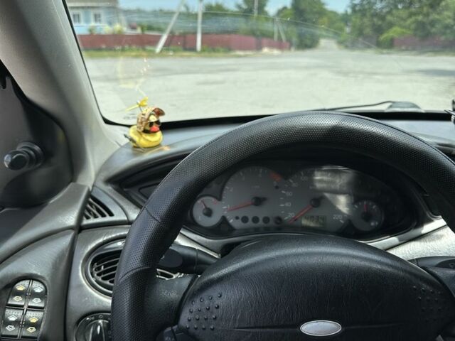 Серый Форд Фокус, объемом двигателя 1.8 л и пробегом 327 тыс. км за 1309 $, фото 6 на Automoto.ua