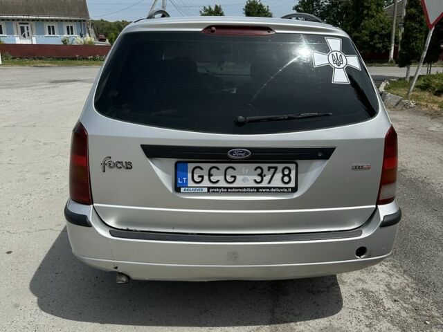Серый Форд Фокус, объемом двигателя 1.8 л и пробегом 327 тыс. км за 1309 $, фото 5 на Automoto.ua