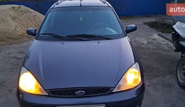 Серый Форд Фокус, объемом двигателя 1.8 л и пробегом 336 тыс. км за 3950 $, фото 9 на Automoto.ua