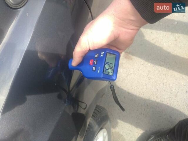 Сірий Форд Фокус, об'ємом двигуна 2 л та пробігом 210 тис. км за 5599 $, фото 1 на Automoto.ua