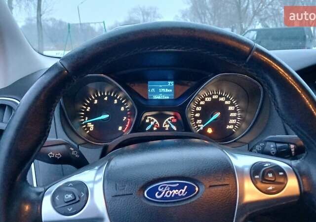 Синій Форд Фокус, об'ємом двигуна 1 л та пробігом 164 тис. км за 6000 $, фото 10 на Automoto.ua
