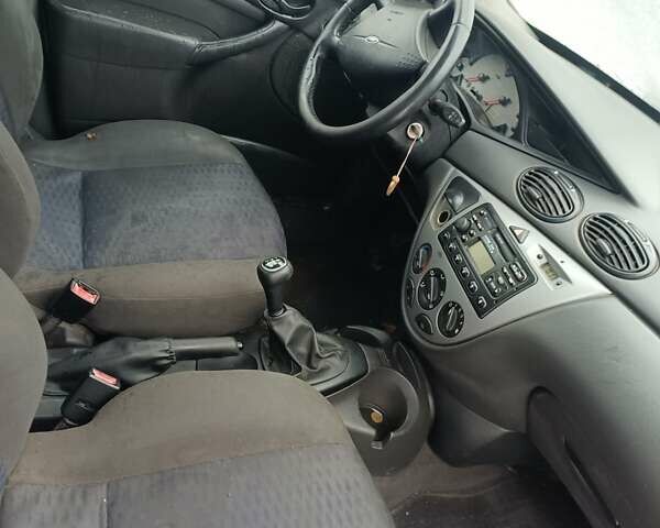 Синий Форд Фокус, объемом двигателя 1.8 л и пробегом 210 тыс. км за 1250 $, фото 5 на Automoto.ua