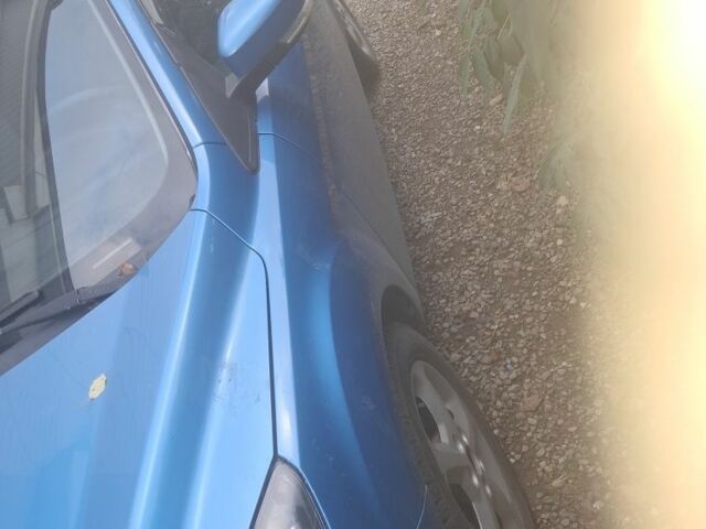 Синий Форд Фокус, объемом двигателя 1.6 л и пробегом 320 тыс. км за 5200 $, фото 1 на Automoto.ua