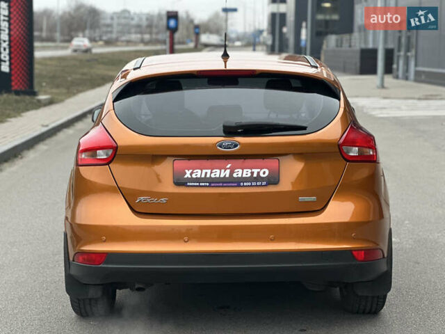 Помаранчевий Форд Фокус, об'ємом двигуна 1 л та пробігом 162 тис. км за 7999 $, фото 4 на Automoto.ua