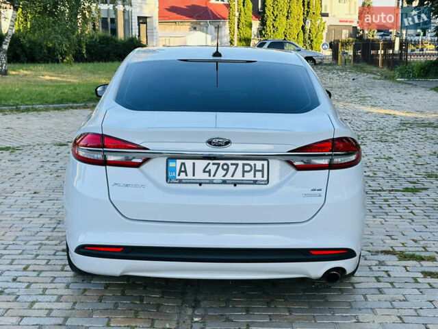 Білий Форд Фьюжен, об'ємом двигуна 1.5 л та пробігом 106 тис. км за 12500 $, фото 4 на Automoto.ua