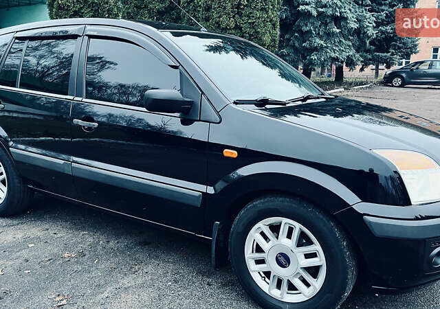 Черный Форд Фьюжн, объемом двигателя 1.4 л и пробегом 173 тыс. км за 5700 $, фото 5 на Automoto.ua