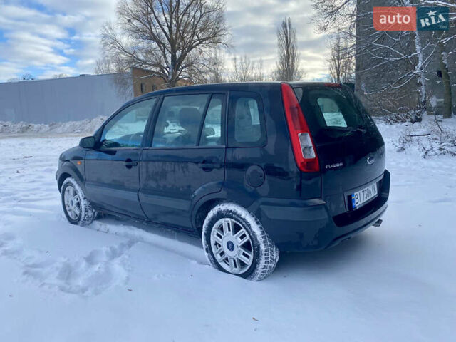Чорний Форд Фьюжен, об'ємом двигуна 1.4 л та пробігом 193 тис. км за 4350 $, фото 3 на Automoto.ua