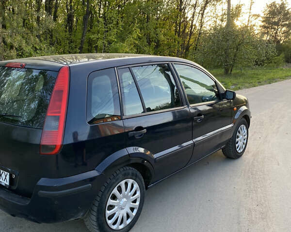 Синій Форд Фьюжен, об'ємом двигуна 1.4 л та пробігом 369 тис. км за 2600 $, фото 8 на Automoto.ua
