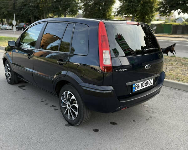 Синій Форд Фьюжен, об'ємом двигуна 1.39 л та пробігом 233 тис. км за 4650 $, фото 12 на Automoto.ua