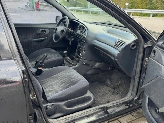 Черный Форд Мондео, объемом двигателя 1.8 л и пробегом 250 тыс. км за 1400 $, фото 12 на Automoto.ua