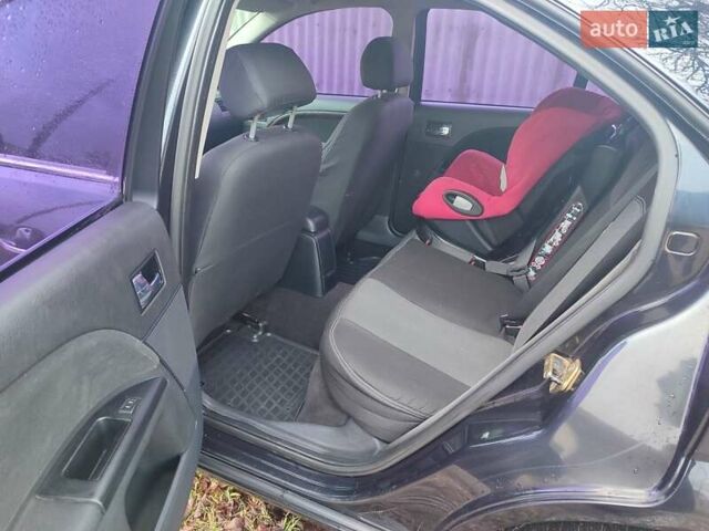 Черный Форд Мондео, объемом двигателя 2 л и пробегом 225 тыс. км за 5900 $, фото 8 на Automoto.ua