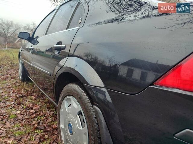 Черный Форд Мондео, объемом двигателя 2 л и пробегом 225 тыс. км за 5900 $, фото 6 на Automoto.ua