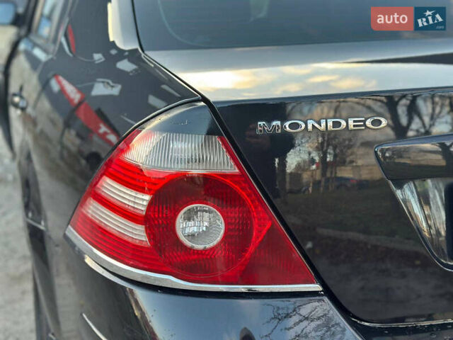 Черный Форд Мондео, объемом двигателя 2 л и пробегом 260 тыс. км за 4799 $, фото 31 на Automoto.ua