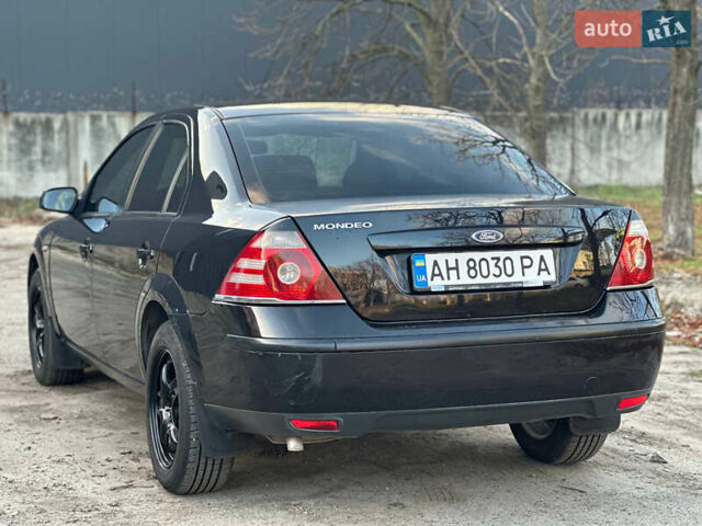 Черный Форд Мондео, объемом двигателя 2 л и пробегом 260 тыс. км за 4799 $, фото 7 на Automoto.ua
