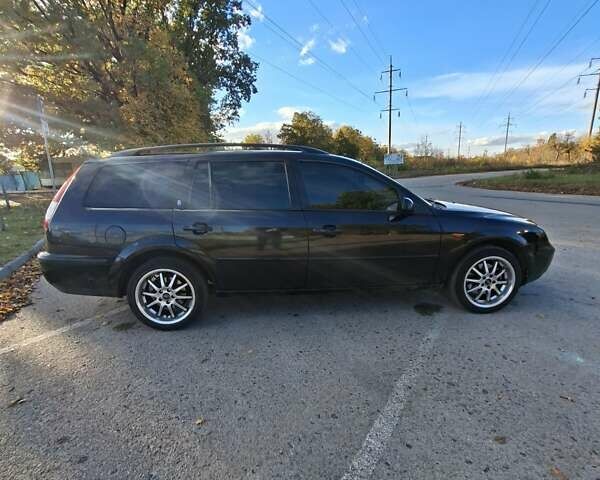 Черный Форд Мондео, объемом двигателя 2 л и пробегом 208 тыс. км за 4500 $, фото 9 на Automoto.ua