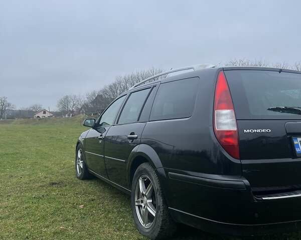 Черный Форд Мондео, объемом двигателя 2 л и пробегом 250 тыс. км за 3135 $, фото 4 на Automoto.ua