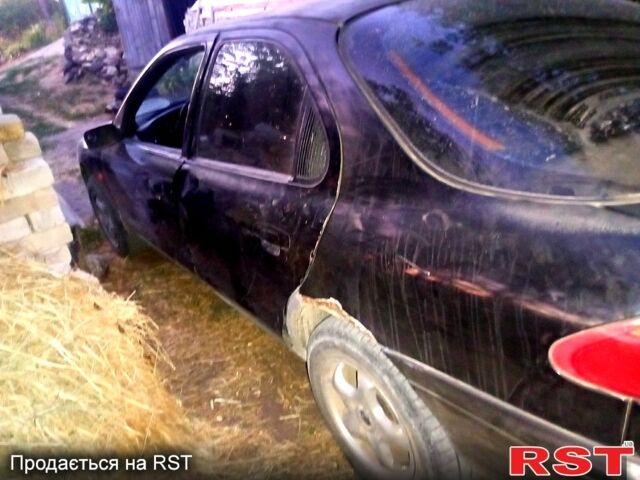 Черный Форд Мондео, объемом двигателя 1.8 л и пробегом 290 тыс. км за 1100 $, фото 3 на Automoto.ua