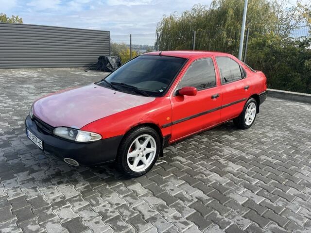 Красный Форд Мондео, объемом двигателя 1.8 л и пробегом 100 тыс. км за 1900 $, фото 1 на Automoto.ua