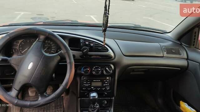 Красный Форд Мондео, объемом двигателя 1.8 л и пробегом 370 тыс. км за 1900 $, фото 8 на Automoto.ua