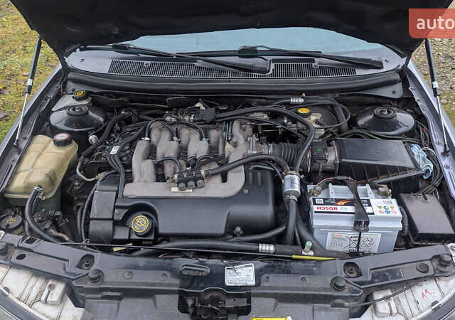 Серый Форд Мондео, объемом двигателя 2.5 л и пробегом 239 тыс. км за 2500 $, фото 8 на Automoto.ua