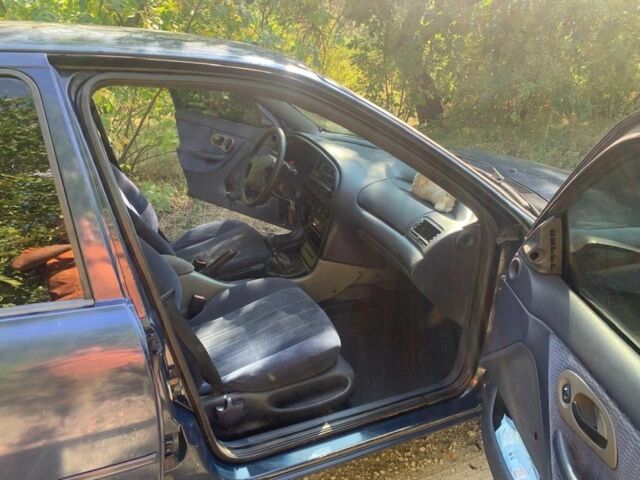 Синий Форд Мондео, объемом двигателя 1.8 л и пробегом 450 тыс. км за 1800 $, фото 5 на Automoto.ua